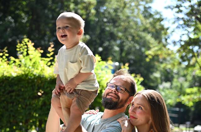 Family laughing together during their photo shoot